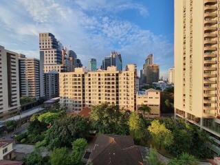 Cityscape view with multiple high-rise residential buildings and green spaces