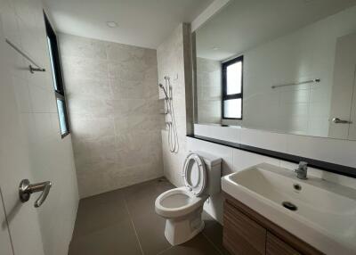 Modern bathroom with large mirror and shower