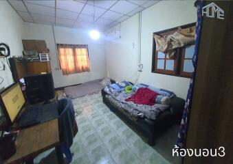 Bedroom with basic furnishings and two sleeping areas