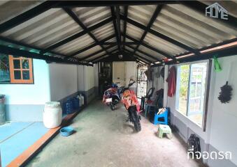 Garage space with motorcycles and various items