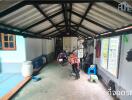 Garage space with motorcycles and various items