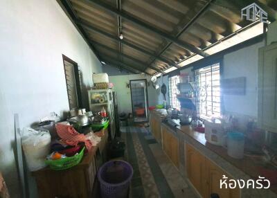 a cluttered kitchen with various kitchen items and appliances