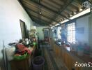 a cluttered kitchen with various kitchen items and appliances