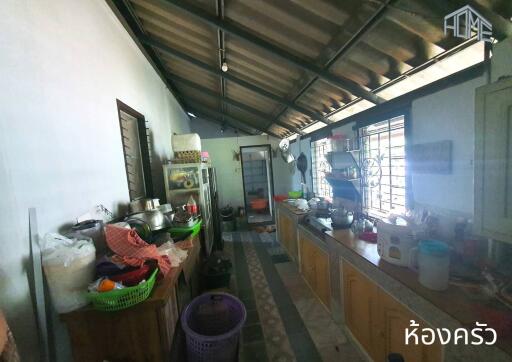 a cluttered kitchen with various kitchen items and appliances