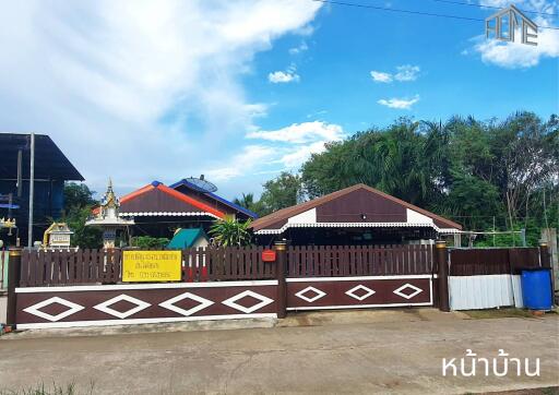 Front view of the property with a gated entrance