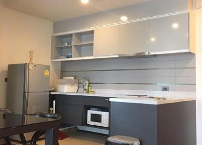 Modern kitchen with appliances and dining area