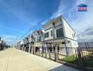 Row of modern townhouses with clear blue sky in the background