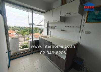 kitchen with cabinets and balcony view