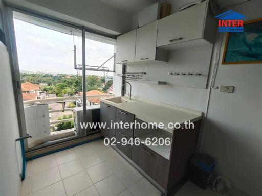 kitchen with cabinets and balcony view