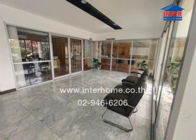 Lobby area with chairs and glass partitions