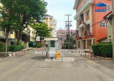 Residential complex entrance with security booth