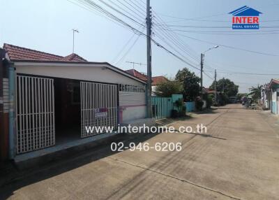 Exterior view of a house with gated entrance