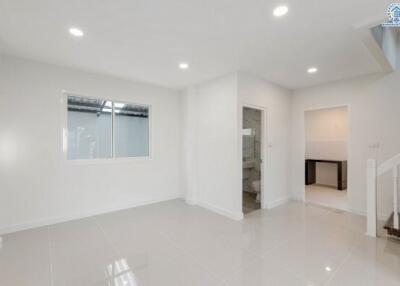 Modern living room with bright lighting and tiled floor