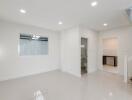 Modern living room with bright lighting and tiled floor