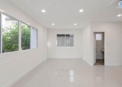 Bright, spacious living room with large windows