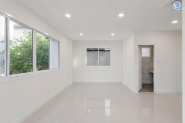 Bright, spacious living room with large windows