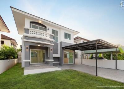 Modern two-story house with a carport