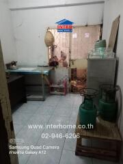 Kitchen with gas canisters and appliances