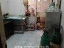 Kitchen with gas canisters and appliances