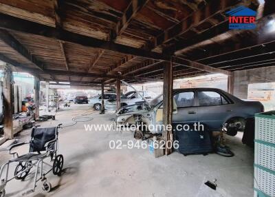 Spacious garage with exposed wooden beams