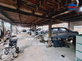 Spacious garage with exposed wooden beams