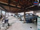 Spacious garage with exposed wooden beams