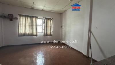 Empty living room with curtains and window