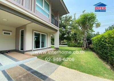 Exterior view of a residential building with a lawn