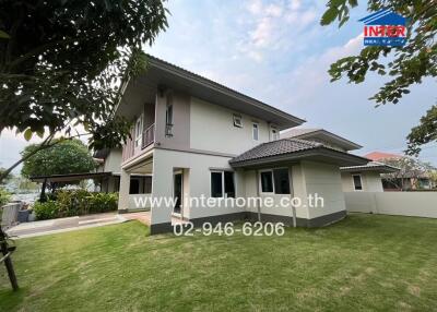 Front view of the house with a well-maintained lawn