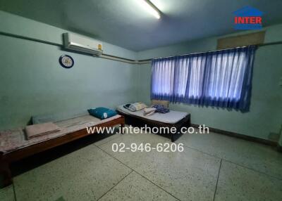 Bedroom with twin beds and air conditioner