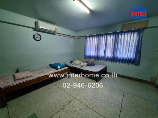 Bedroom with twin beds and air conditioner