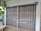 Front view of a secured building entrance with metal gates