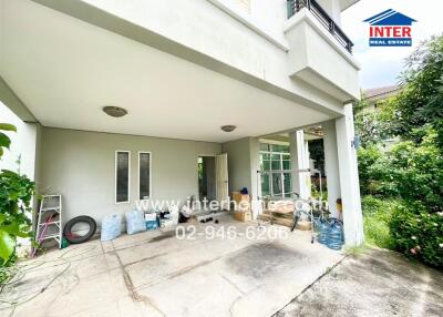 Covered parking area with garden view