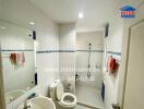 Clean and modern bathroom with white tiles and blue accents