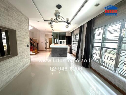 Modern kitchen with island and large windows