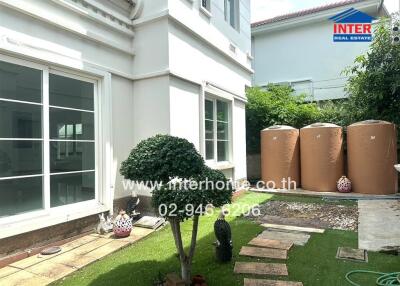 Backyard with garden and water tanks