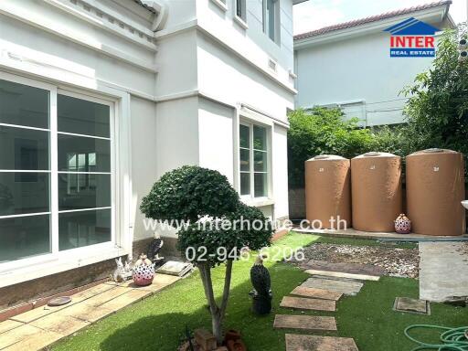 Backyard with garden and water tanks