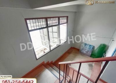 indoor stairway with window and railings