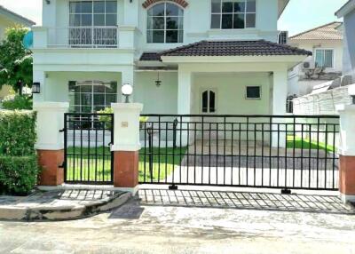 Two-story house with a gated driveway