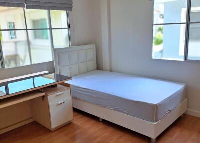 Bedroom with single bed and desk