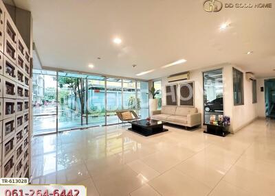 Lobby area with modern furniture and large windows