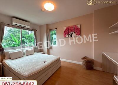 well-lit bedroom with window and bed