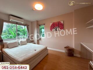 well-lit bedroom with window and bed