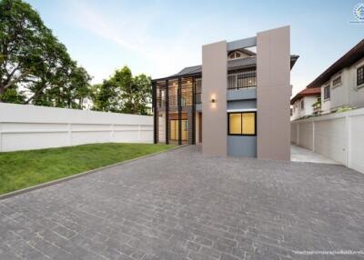 Modern two-story house with driveway and lawn