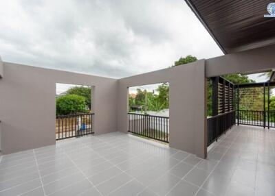 Spacious outdoor balcony with tiled flooring and open views