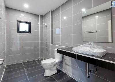 Modern bathroom with tiled walls and floors