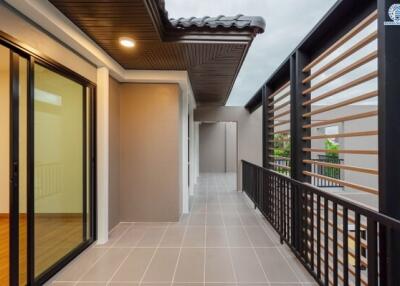 Modern balcony with tiled floor and sliding glass doors