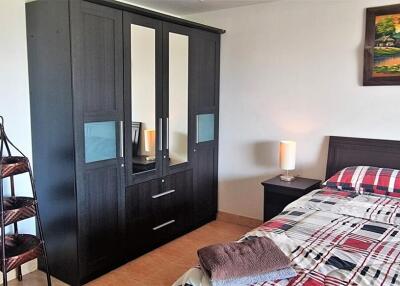 Bedroom with wardrobe and bed