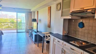 Combined living room and kitchen with balcony