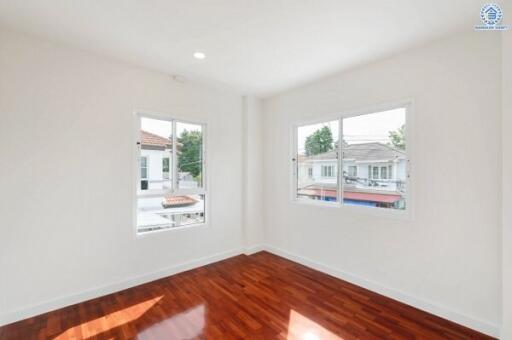 bright and spacious bedroom with wooden floor